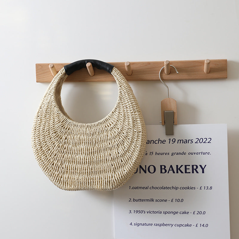 Curved Woven Straw Clutch